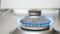 Blue flame on a kitchen stove burner