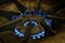 Blue flames with gas cooking burner in a kitchen