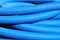 Blue flexible hose coiled.