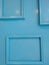 Blue frames on blue walls