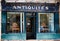 Blue French antique shop front with flaking paint in Beaune, Burgundy