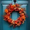 Blue front door with festive autumn wreath