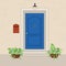 Blue front door with a mailbox on the wall and flowers in the po