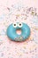 Blue funny surprised donut on pink background