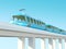 Blue futuristic train on the bridge