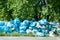 Blue garbage bags full of trash left on the street pollute the city.