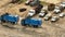 Blue garbage trash trucks shot with aerial drone