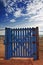 Blue gate on beach