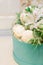 Blue gift box with beautiful flowers white alstroemeria and macarons