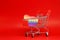 Blue Gift box in Shopping cart on Blue background - Love Valentine , birthday , or special thank shopping - marketing advertise lo