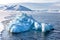 Blue glacial iceberg at the edge of the fast ice, Svalbard