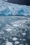 Blue glacier and calving ice in the Alaskan ocean waters