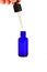 blue glass bottles.A bottle with a pipette, isolated on a white background. glass container for cosmetic skin care products.