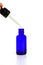 blue glass bottles.A bottle with a pipette, isolated on a white background. glass container for cosmetic skin care products.