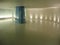Blue glass colomn in an underground corridor