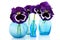 Blue glass vases with Pansies