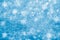 Blue glitter sparkles snow flakes background