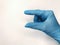 Blue glove on a white background. Shows a little bit
