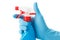 Blue gloved hand with cleaning spray bottle