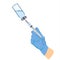 A blue-gloved medical nurse draws an ampoule into a syringe.