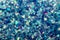 Blue glowing mica glitter colorful confetti abstract background