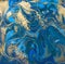 Blue and gold liquid texture. Hand drawn marbling background. Ink marble abstract pattern