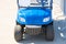 Blue golf car front and headlights, bumper