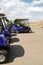 Blue Golf Carts Parked in a Row