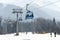 Blue gondola cabin lifts at a ski resort from town to ski slopes in mountain