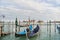 Blue gondolas parked in the Venetian lagoon, the Grand Canal in Venice, Italy
