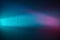 On a blue gradient background, a turquoise ray of light and a pink glow