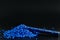 Blue granules of polypropylene, polyamide. Background. Plastic and polymer industry. Microplastic products.