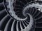 Blue gray industrial air craft turbine blades spiral background pattern distorted by three coils. Metal turbine wings repetitive b