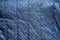 Blue gray synthetics fabric background of a fragment of crumpled cloth