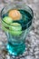 Blue green Cola glass with ice cubes