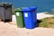 Blue and green containers for waste sorting, sort garbage for paper and glass.