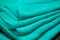 Blue, green, marine silk tender colored textile, elegance rippled material