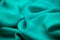 Blue, green, marine silk tender colored textile, elegance rippled material