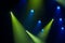Blue and green rays of light through the smoke on stage. lighting equipment. Spotlight