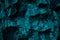 Blue green rock texture. Toned the rough surface of the mountain. Close-up. 3d shape. Dark teal stone background with space for de