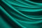 Blue green silk satin. Emerald curtain. Drapery. Shiny fabric. Elegant background.
