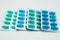 Blue and green soft gelatin capsules in blister pack