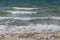 Blue Green Waves Heading Towards a Beach on Lake Michigan