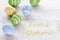 Blue Green And Yellow Easter Eggs With German Text Frohe Ostern Means Happy Easter