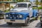 Blue, grey classic vintage pickup truck standing