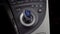 Blue and grey coloured gear stick with white symbols