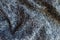 Blue grey melange woolen fabric in soft folds