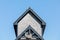 Blue and grey rooftop and decorative gable end wall