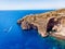 Blue Grotto in Malta. Aerial top view from Mediterranean sea island of birds