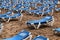 Blue hammocks lined up on Levante Beach in Benidorm